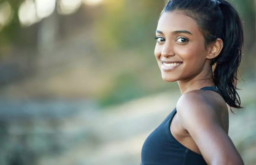 I run for fun and better health. Portrait of a sporty young woman exercising outdoors.