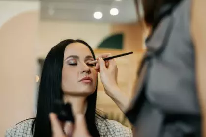 Close-up of a makeup artist doing eye makeup