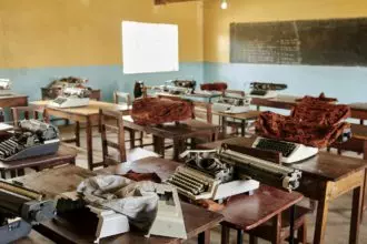 Classroom with typewriters in a poor African school