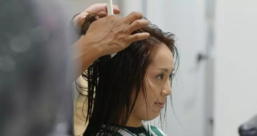 Woman with hair cut at beauty salon