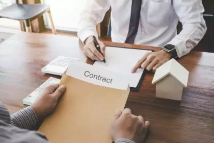 Business Signing a Contract Buy - sell house