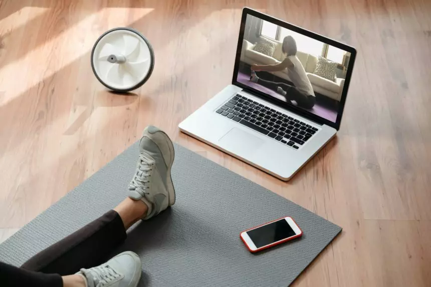 Online training at home with laptop and smartphone