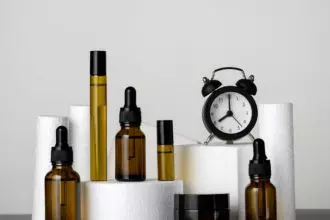 Cosmetic products and clock, morning and evening skin and body care concept