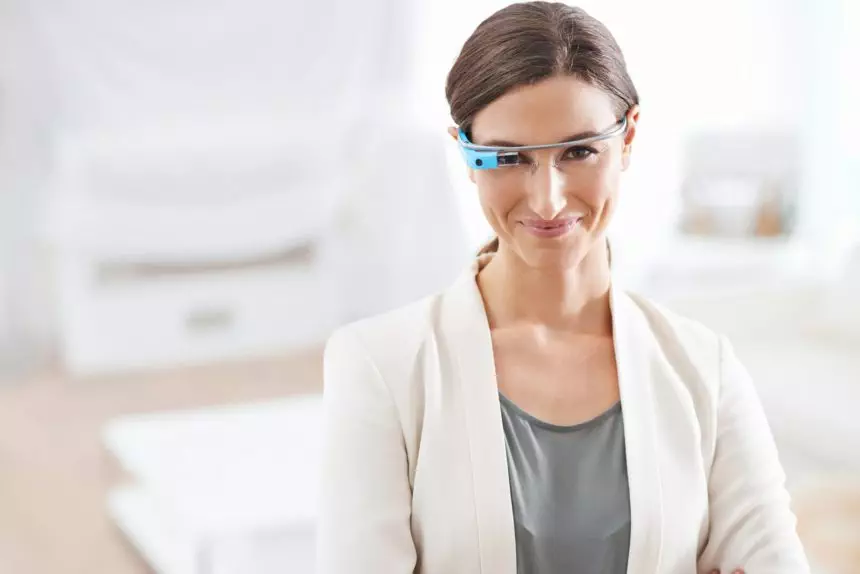 Instant access. Portrait of a young businesswoman wearing smart glasses at work.
