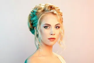 Blonde girl with long and shiny curly hair