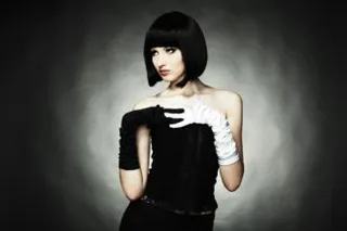 Fashion portrait of young beautiful woman in the black dress